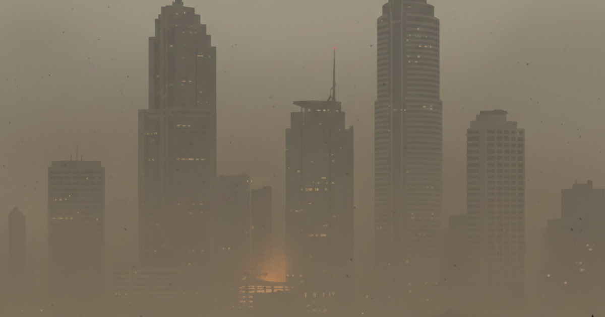 Ilustrasi kabut asap tebal menyelimuti gedung-gedung tinggi di kota besar Indonesia, menunjukkan buruknya kualitas udara.