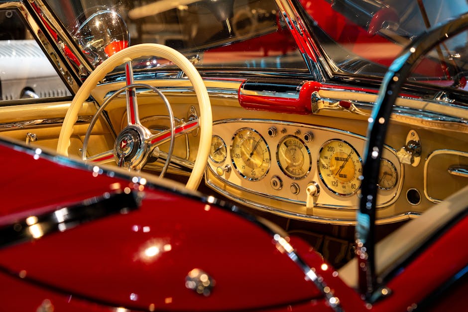 Seorang mekanik profesional sedang memeriksa mesin sepeda motor dengan peralatan diagnostik di bengkel modern.